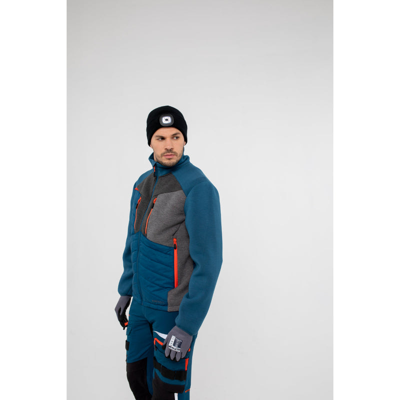 Man in Portwest DX4 Hybrid Baffle Jacket demonstrating bending flexibility.
