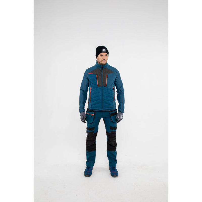Man wearing a Portwest DX4 Hybrid Baffle Jacket in a casual outdoor setting.