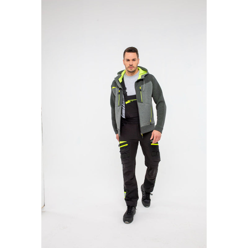 Man in Portwest DX4 Zipped Hoodie adjusting his work trousers.