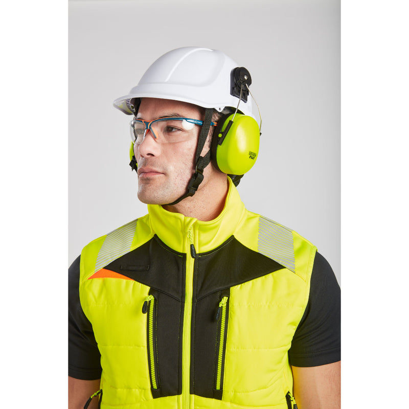Back view of a man in Portwest DX4 Hi-Vis Softshell Bodywarmer outdoors.