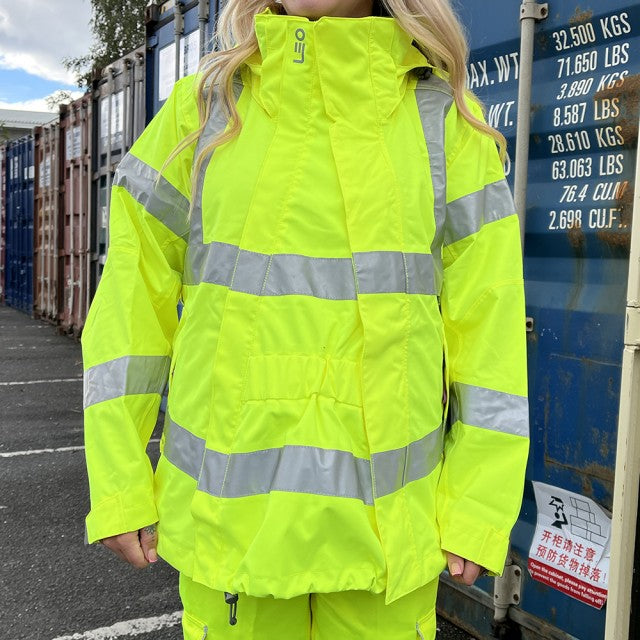 Leo Workwear yellow maternity hi-vis expander panel displayed with dual button adjustment and durable stitching