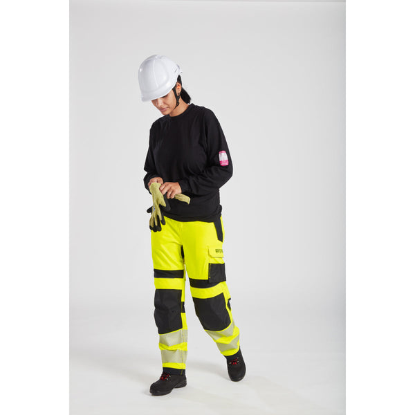 Model wearing Portwest PW3 FR409 Hi-Vis Women's Work Trousers, full front view
