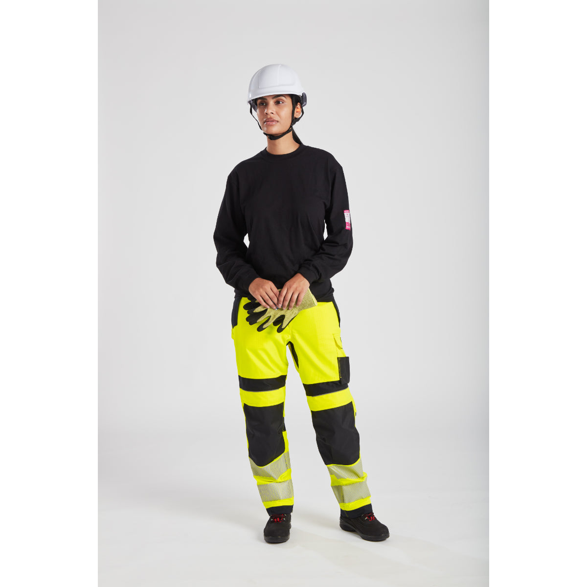 Model showing back view of Portwest PW3 FR409 Hi-Vis Women's Work Trousers