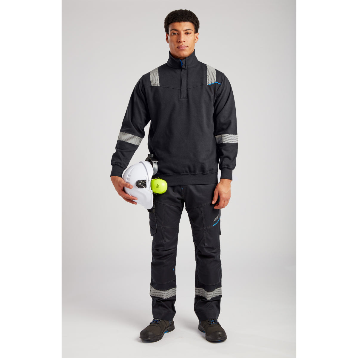 Portwest black flame-resistant jacket paired with full kit