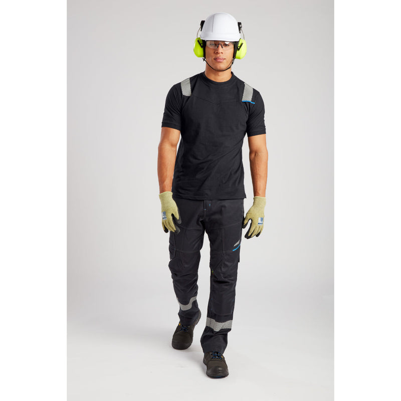 Side view of worker in hi-vis FR jacket and trousers.