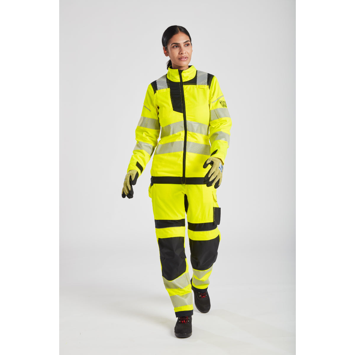 Yellow safety jacket with reflective stripes and black accents for enhanced workplace visibility