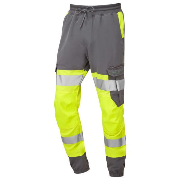Detailed view of the Leo Workwear Hawkridge yellow and grey jog trouser, showing pocket and reflective tape details.