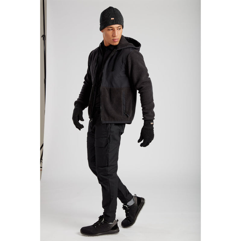 Side view of a model in the full Portwest KX3 workwear outfit.