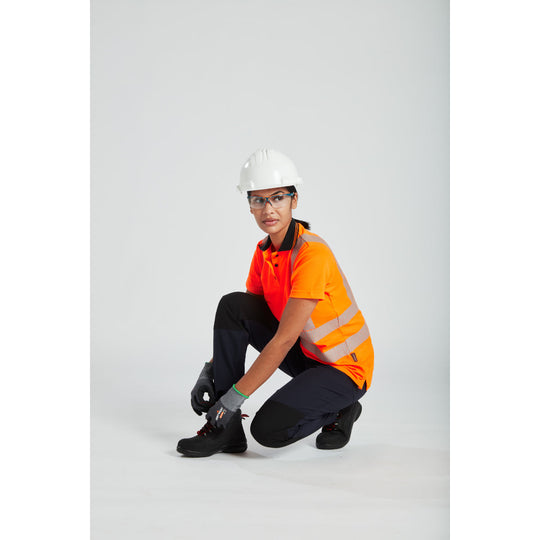 A worker in hi-vis clothing wearing a Portwest Work Safe safety helmet.