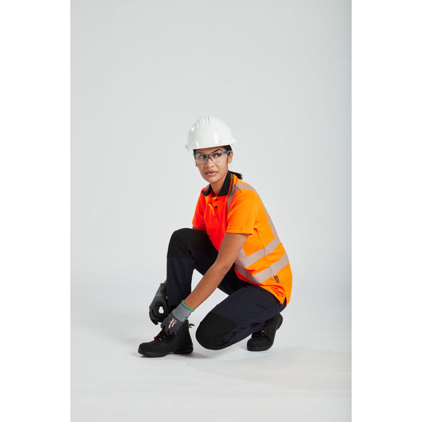 A worker in hi-vis clothing wearing a Portwest Work Safe safety helmet.