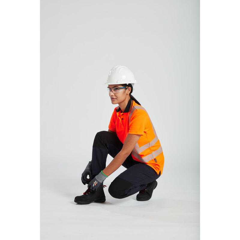 Female worker in full gear, including the stretch work trousers.