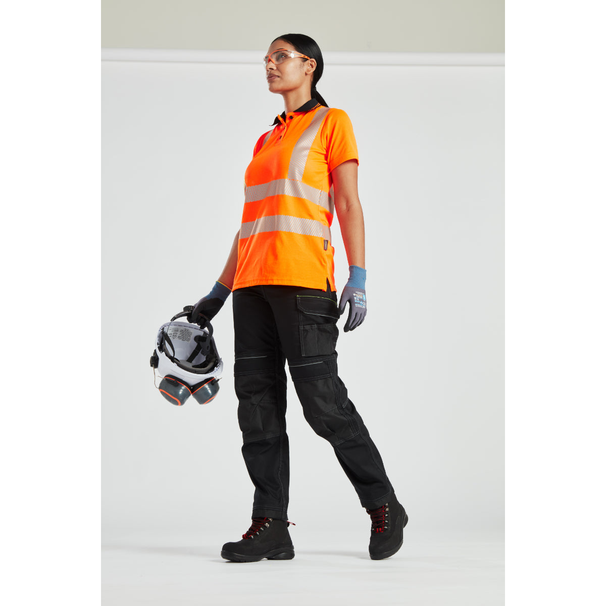 Model walking in the Portwest PW3 Women's Stretch Trouser and jacket.