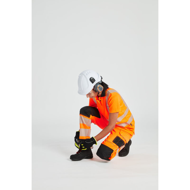 Model sitting to demonstrate the comfort of the PW3 hi-vis women's trousers.