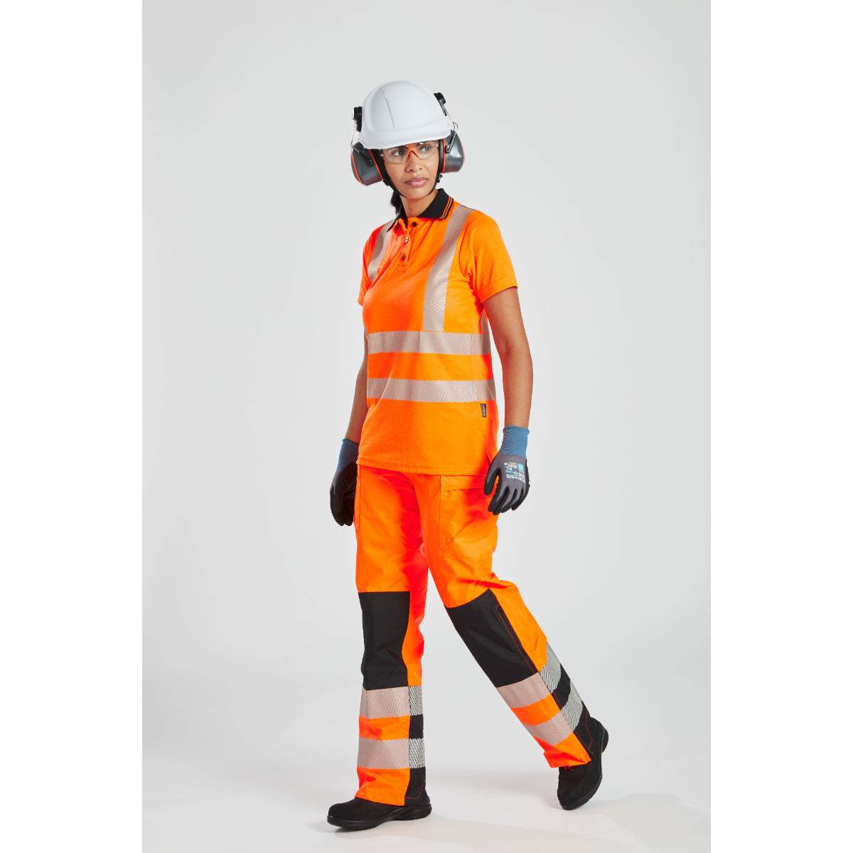 Side profile showing the full Portwest women's hi-vis rainwear system.