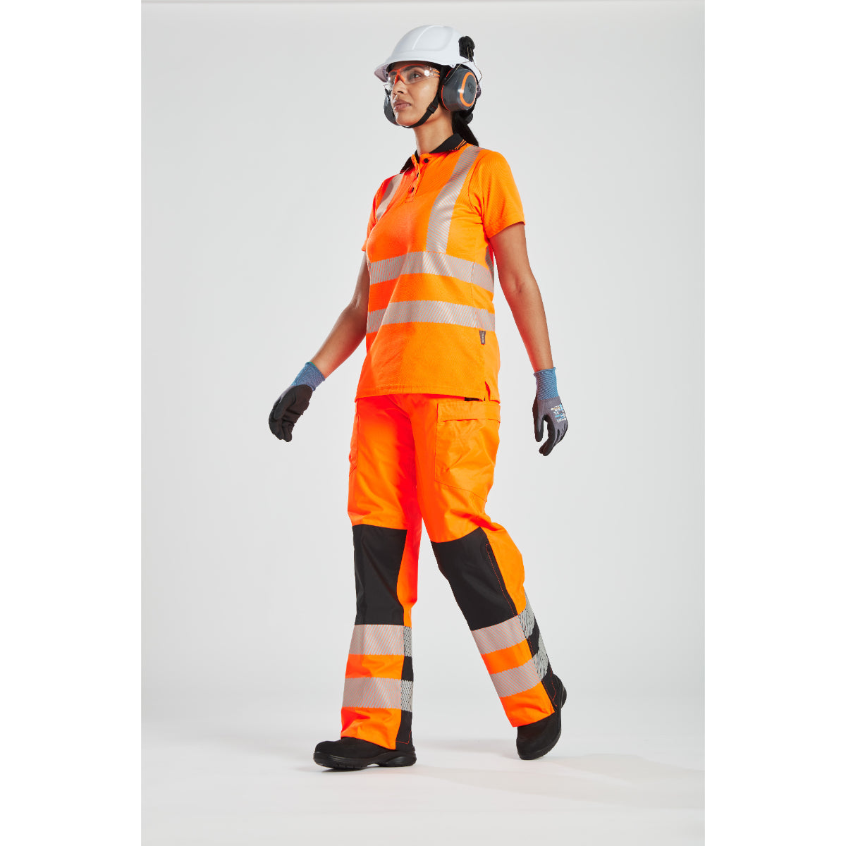 Rear view showcasing the fit and visibility of the women's hi-vis rainwear.