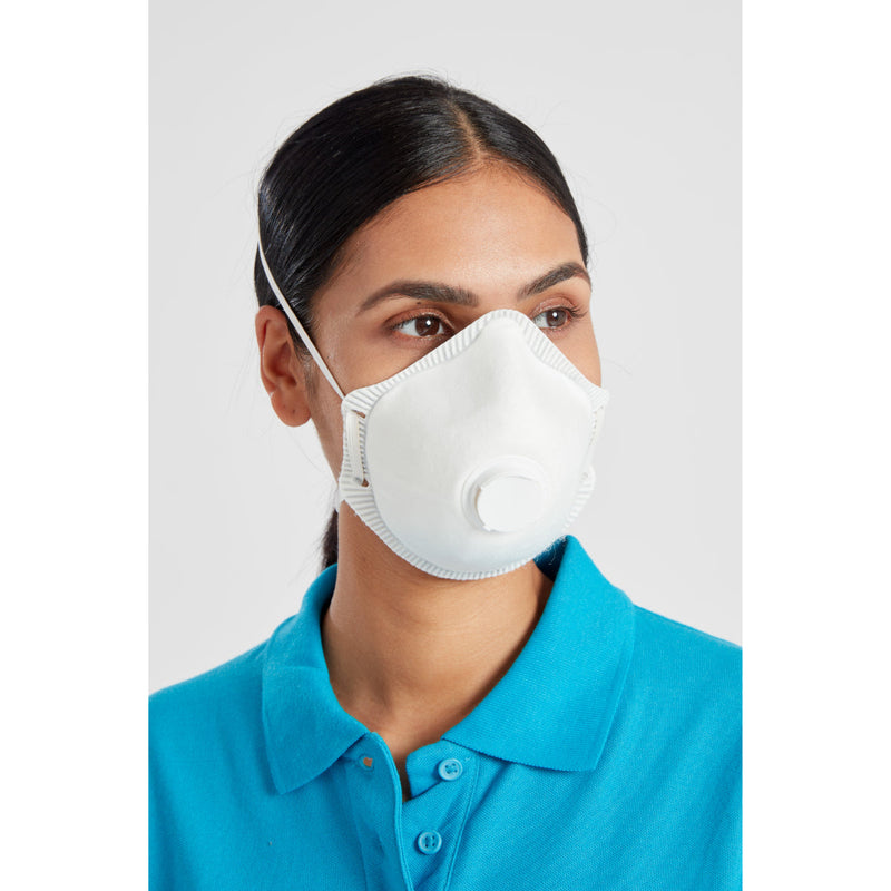 Woman in blue polo shirt wearing a white respirator mask with valve, side profile view