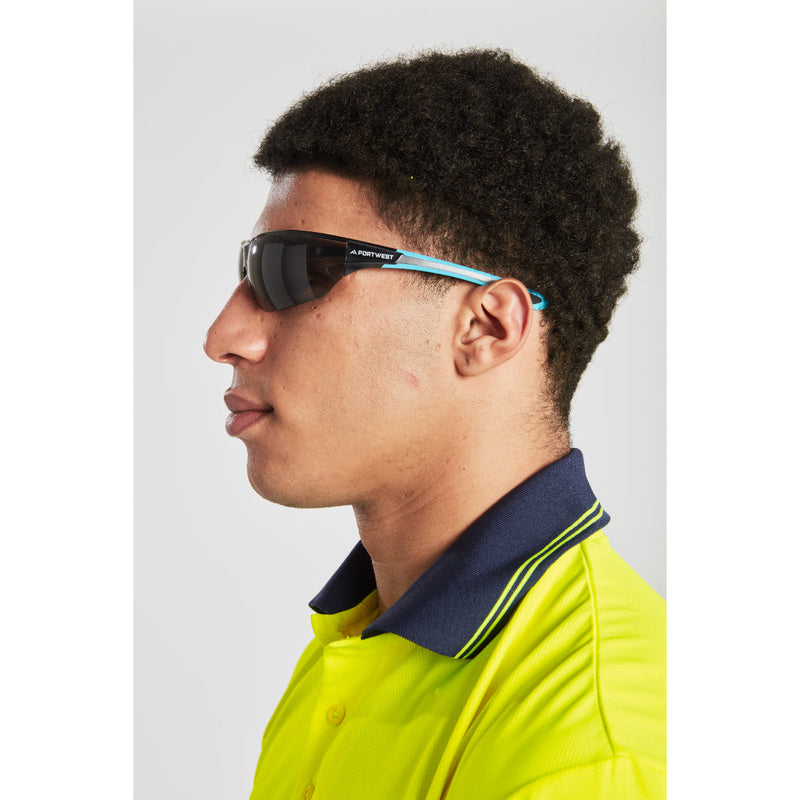 Side profile close-up of the Portwest hi-vis polo, showing sleeve and reflective tape.
