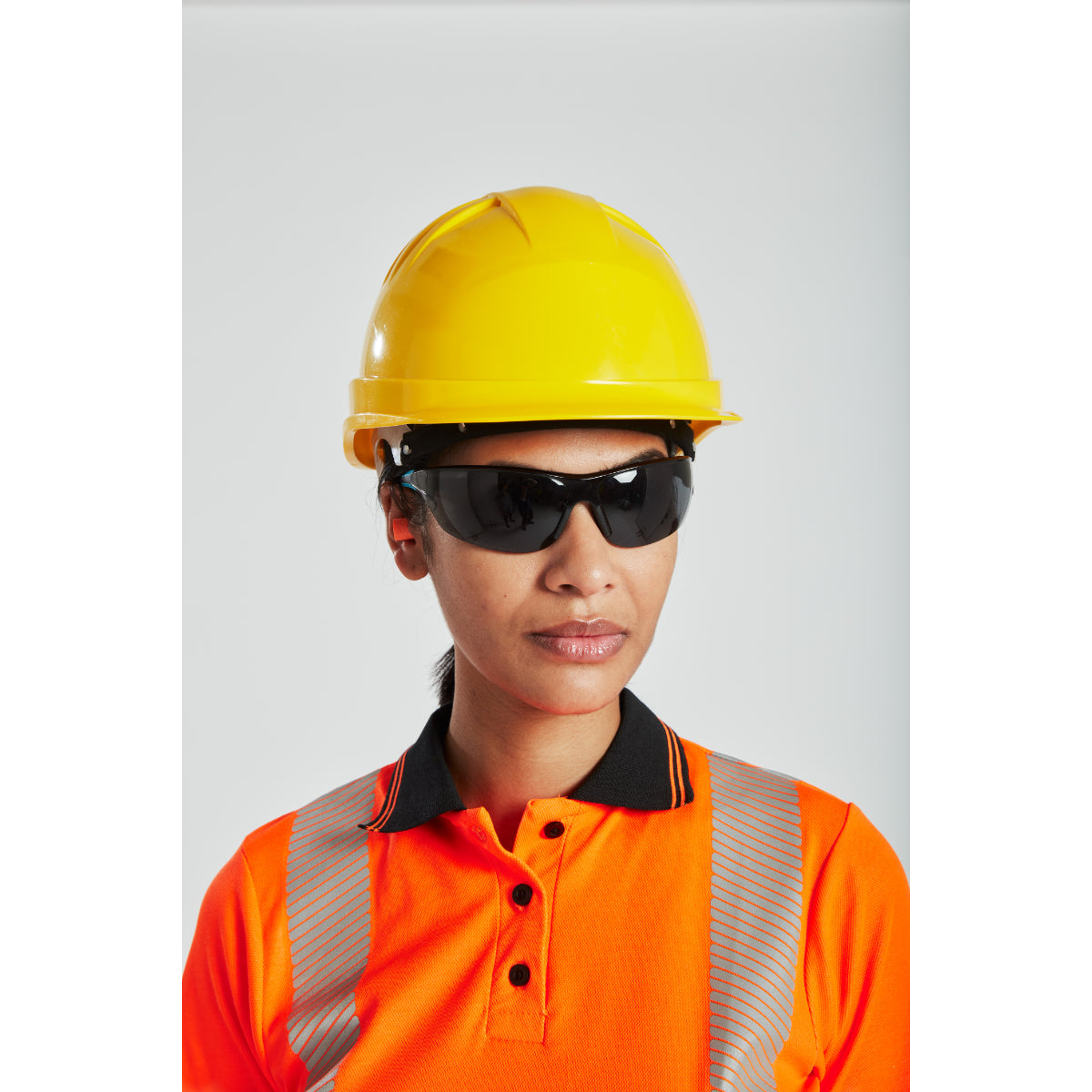 A person attaching a visor to the Portwest Expertline safety helmet.