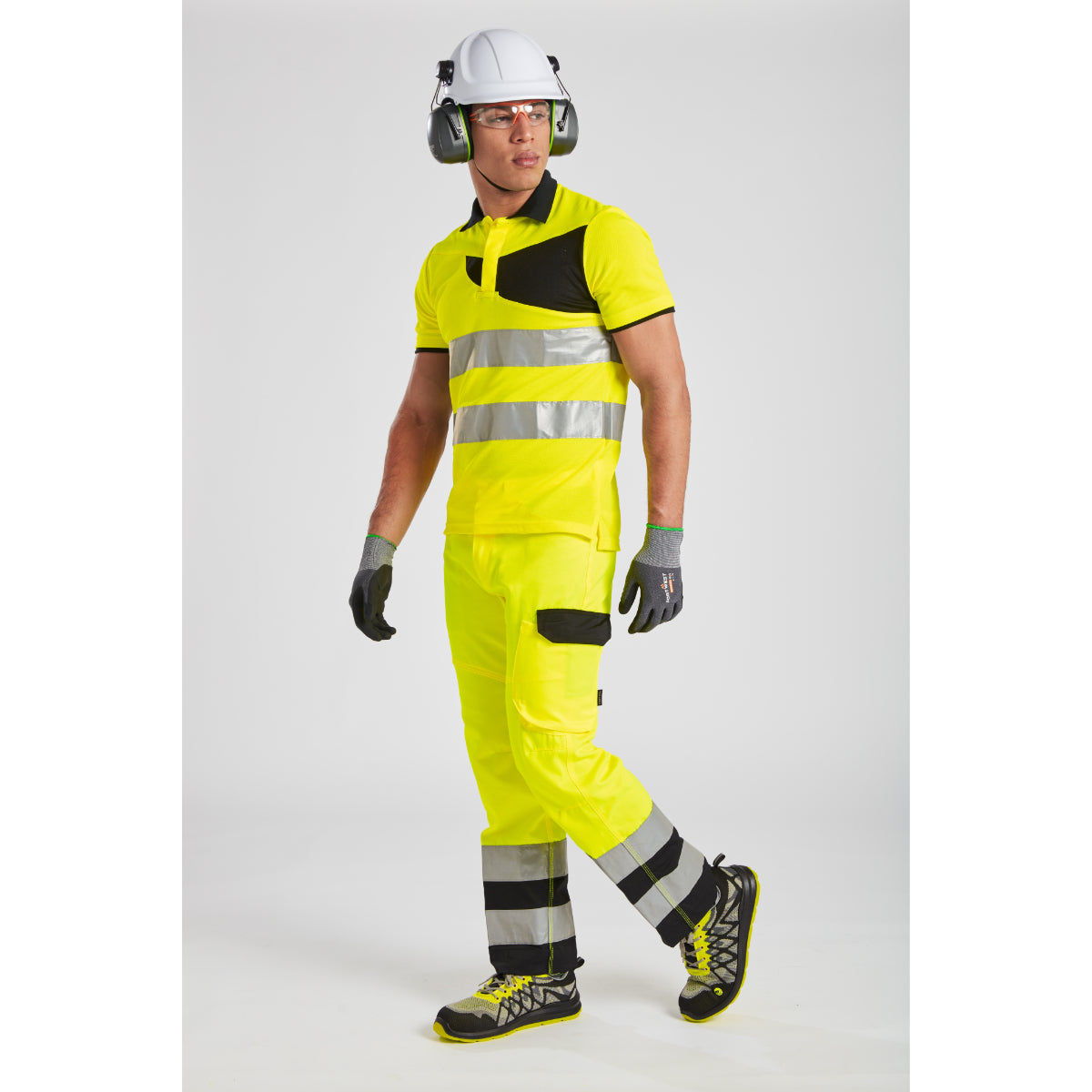 Side view of the worker in the hi-vis service trousers.