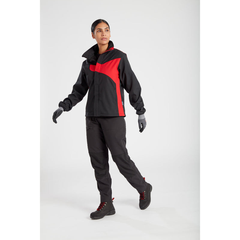 Model posing to show the tool pockets on the women's stretch trousers.