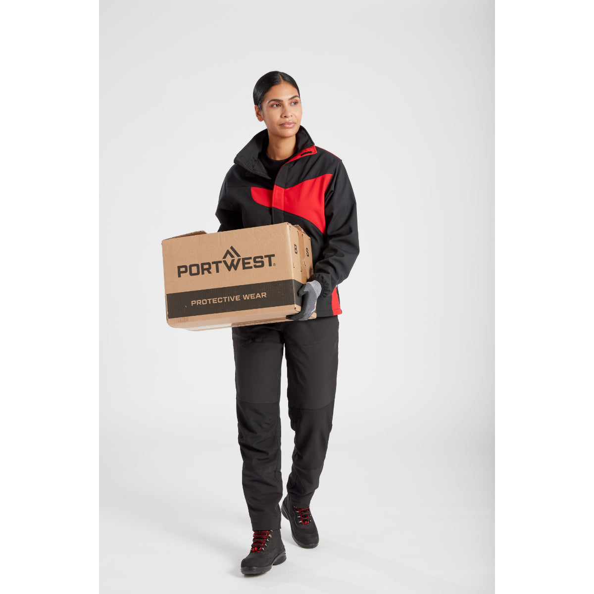 Woman looking to the side while wearing the Portwest Softshell.