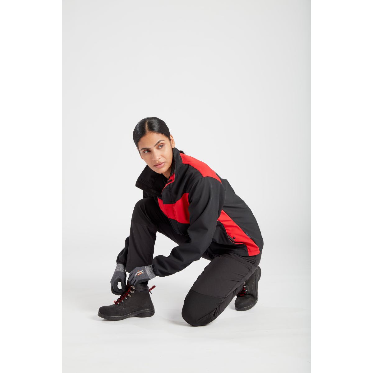 Action pose in the Portwest Women's Softshell jacket.