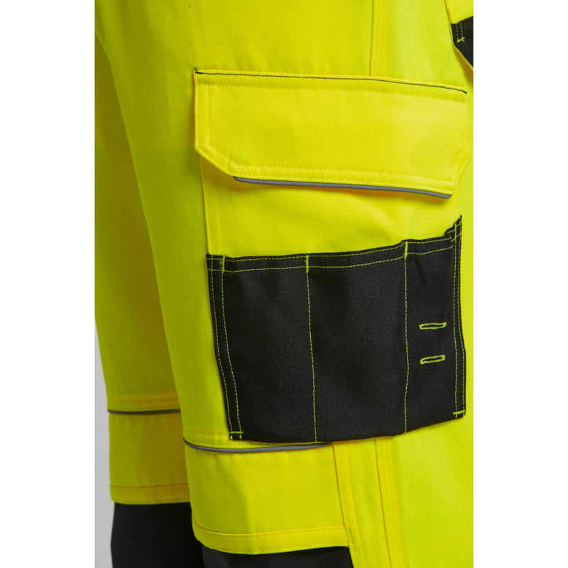 Close-up of the back pocket and branding on the PW3 Hi-Vis Trouser.