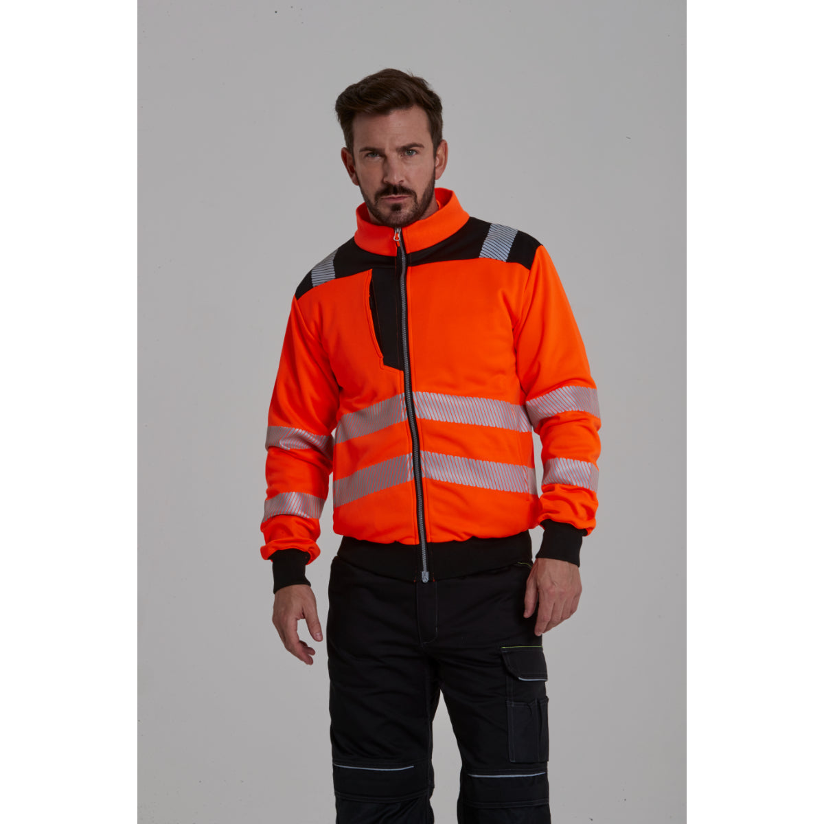 Front view of a model wearing the Portwest PW3 hi-vis zip sweatshirt.
