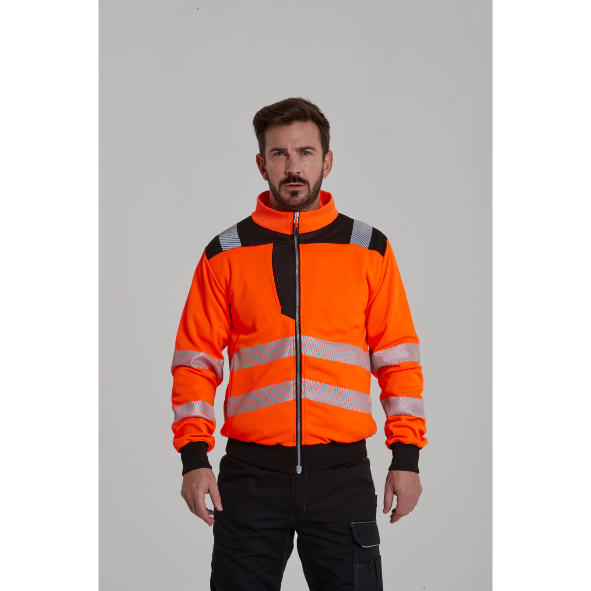 Side view of a model wearing the Portwest PW3 hi-vis sweatshirt.
