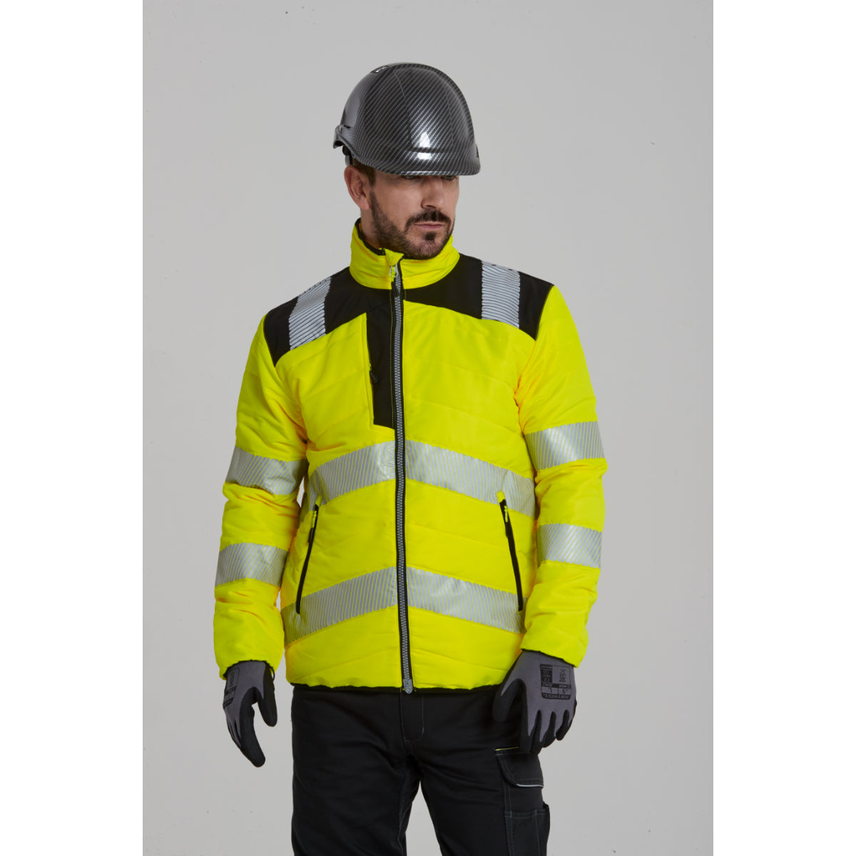 A person in full Portwest gear, including Dermiflex Aqua gloves.