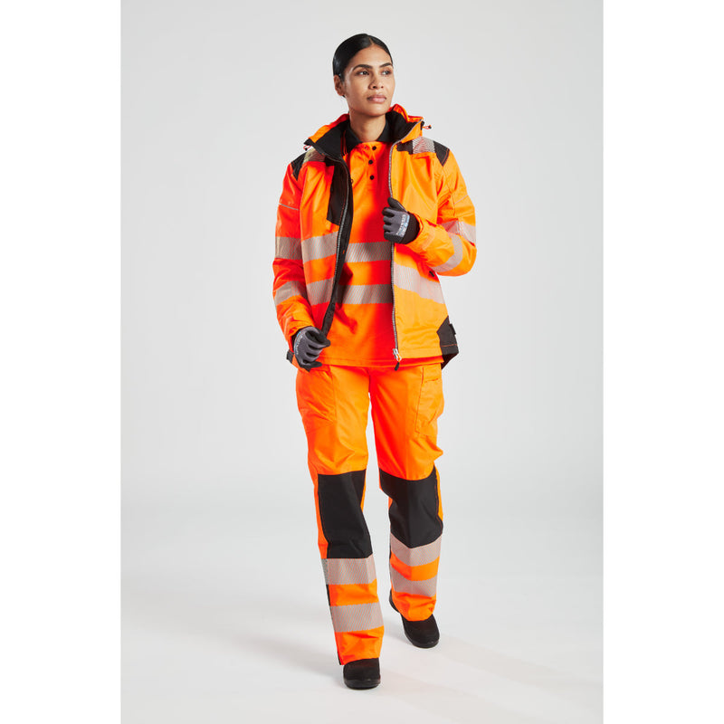 Woman wearing the orange Portwest PW3 Hi-Vis Winter Jacket.

