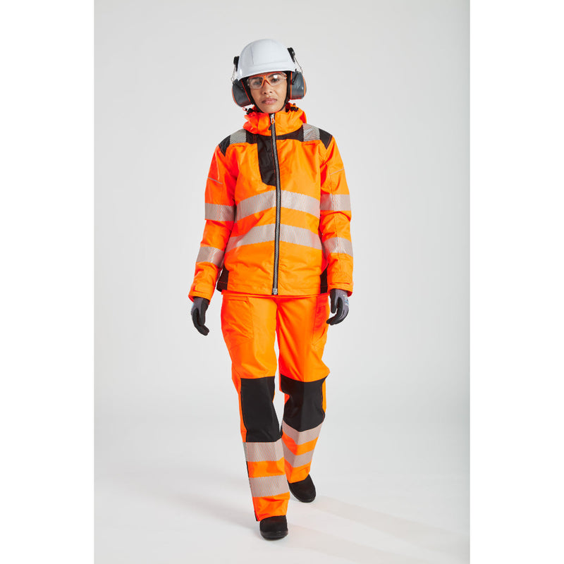 worker wearing Portwest safety gear, highlighting the women's orange PW3 jacket.

