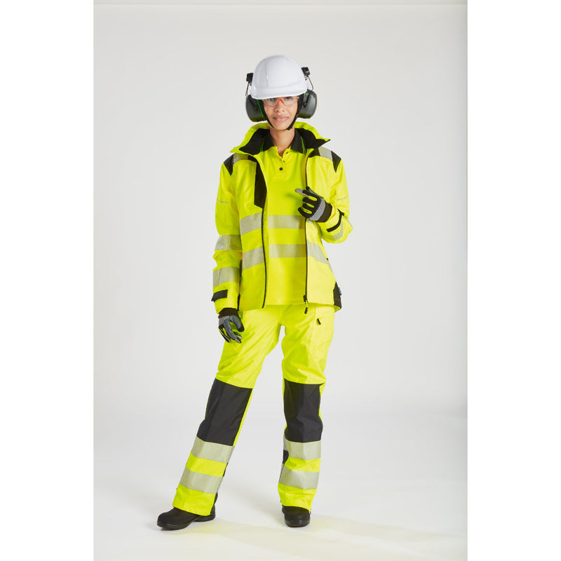 Woman wearing the yellow Portwest PW3 rain jacket.