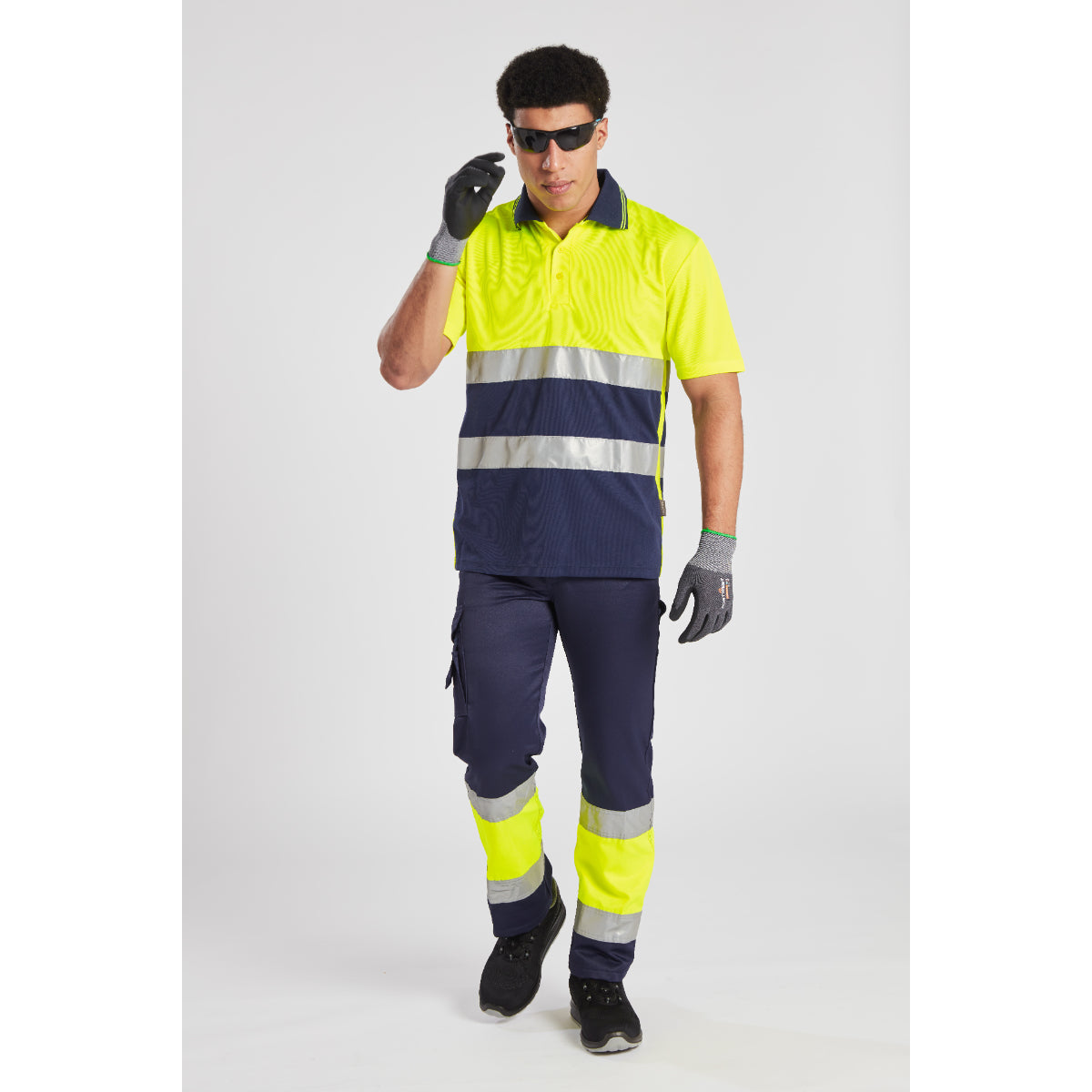 Model wearing the yellow and navy Portwest Hi-Vis Lightweight Trouser.