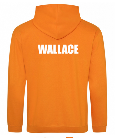 The detailed stitching of the Armadale crest on an ochre-colored kids' hoodie.