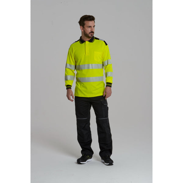 Man wearing the hi-vis polo shirt with matching work trousers.