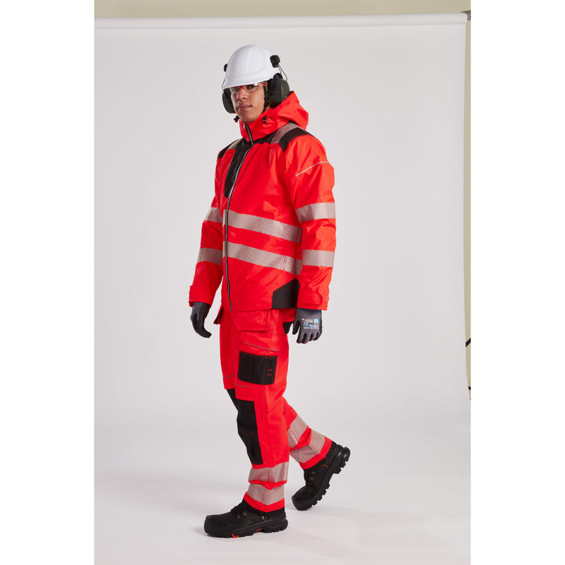 Man in hi-vis gear with ear defenders attached to his hard hat.