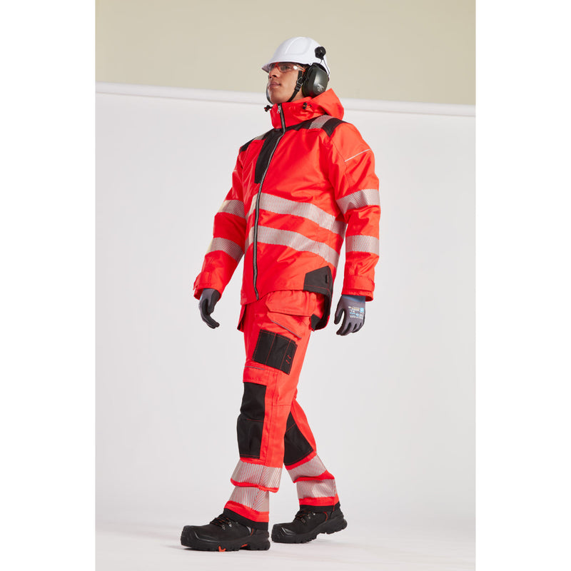 Close-up of a worker in the hi-vis winter jacket and full safety gear.