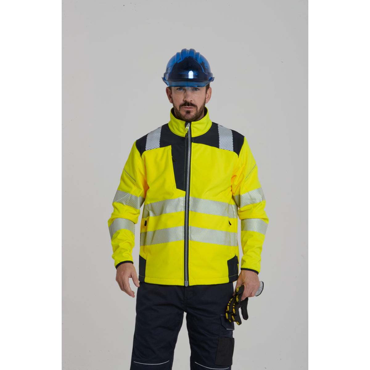 Full view of a worker in Portwest Hi-Vis Softshell and trousers.