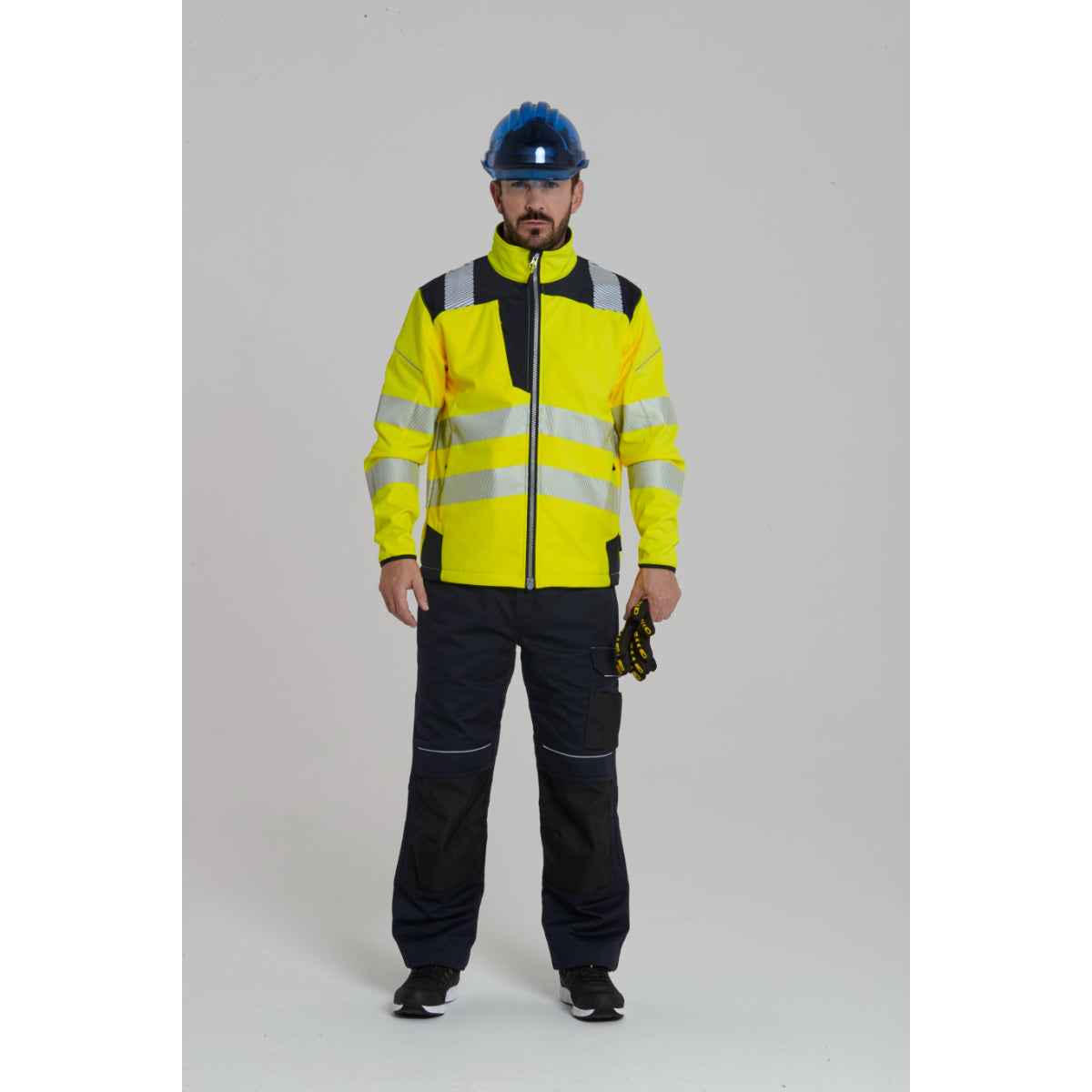 Worker looking up while wearing the Portwest  Hi-Vis Softshell.