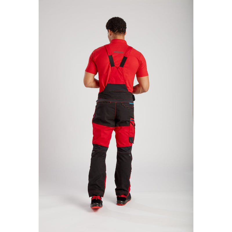 Worker equipped with Portwest WX3 Bib and Brace (T704) and other gear for a complete look.