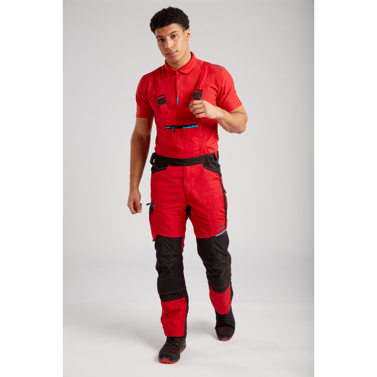 Close-up of a worker's torso wearing the Portwest WX3 Bib and Brace (T704).