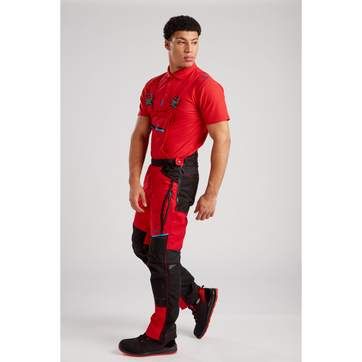 Worker in the Portwest WX3 Bib and Brace (T704) demonstrating ease of movement.
