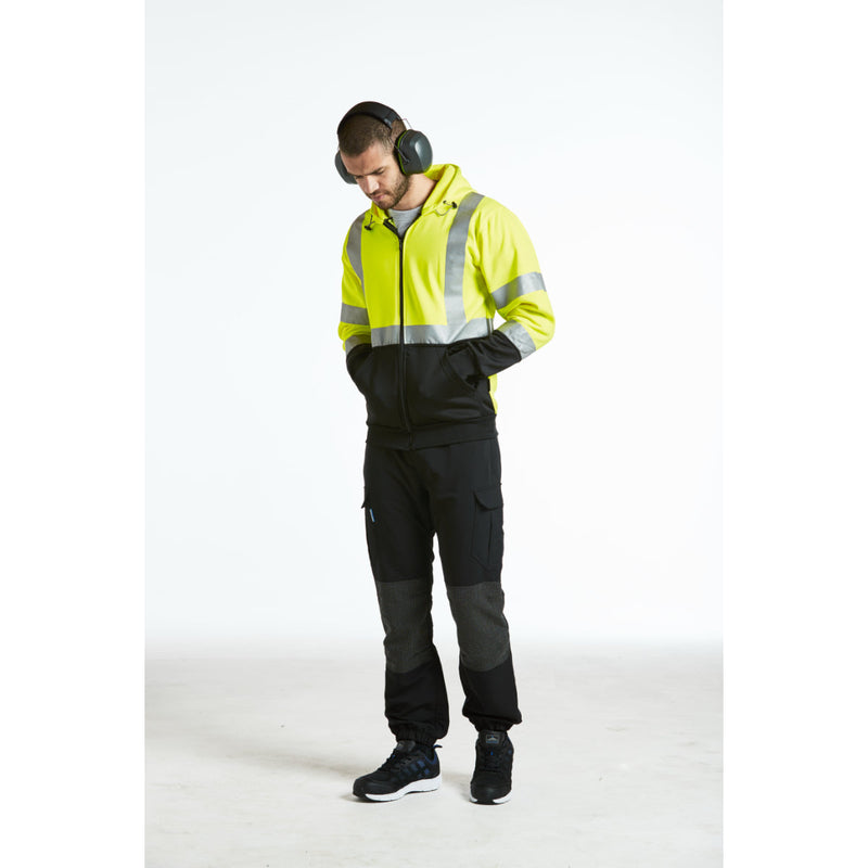 Man wearing Portwest Premium Ear Muffs while working with tools.