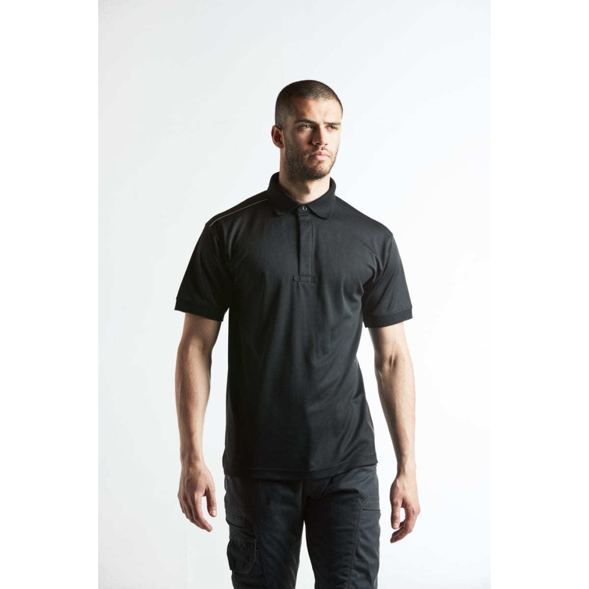 Side view of industrial black jacket and trousers on model