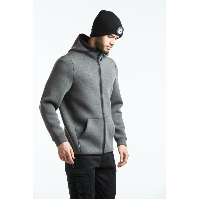 Worker wearing the Portwest Technical Fleece with beanie and trousers.