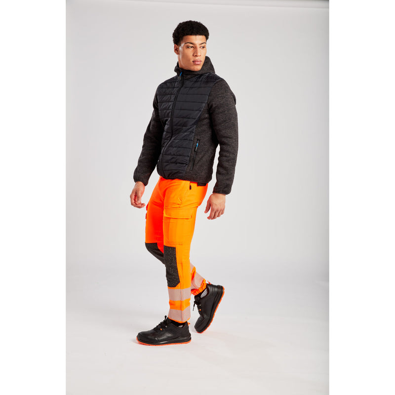 Model looking to the side wearing the Portwest KX3 Hi-Vis Jogger and polo.