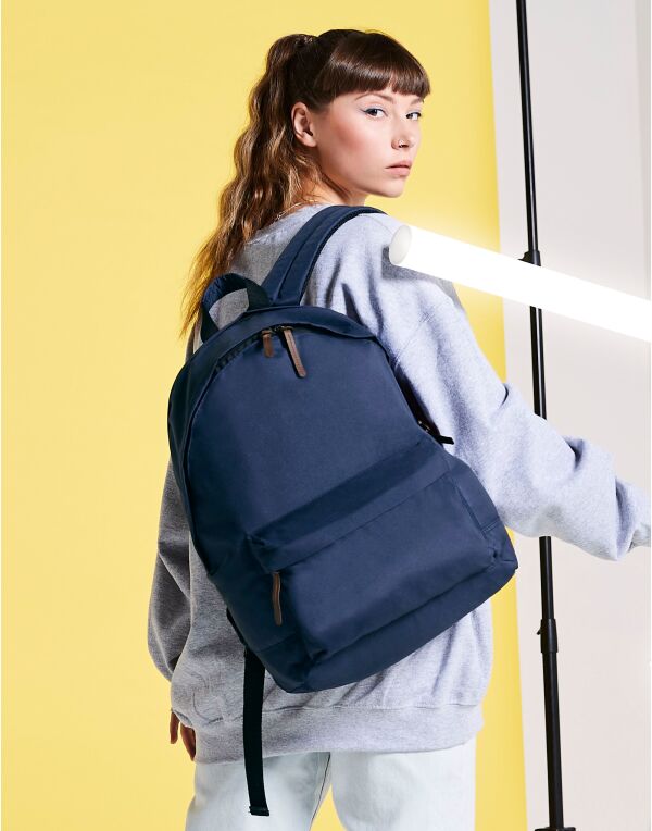 Person holding the grey recycled mini cooler bag, showing scale.