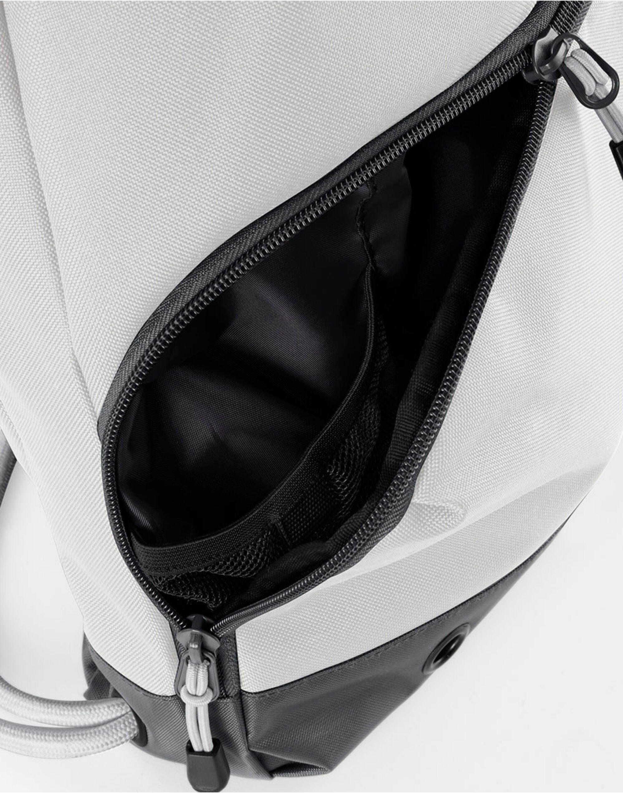Angled shot of the black Bagbase Athleisure Gymsac, highlighting its dual-fabric design.