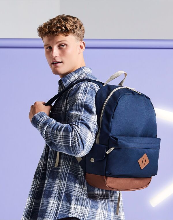 Person wearing the caramel and black heritage backpack.
